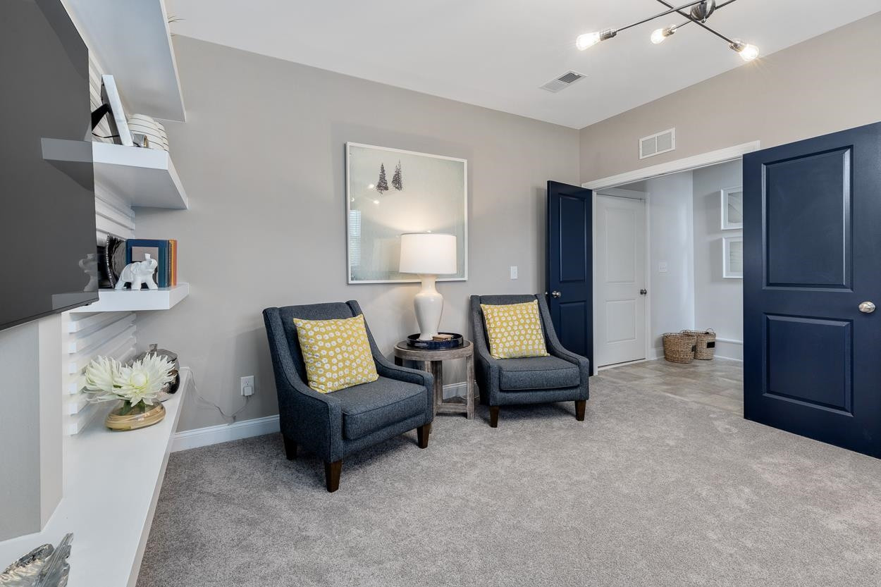 1002 Royal Mill Avenue Wake Forest, NC 27587 - Photo 32 of 51 a living room with furniture and a couch