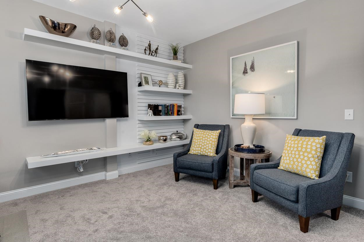 1002 Royal Mill Avenue Wake Forest, NC 27587 - Photo 33 of 51 a living room with furniture and a flat screen tv