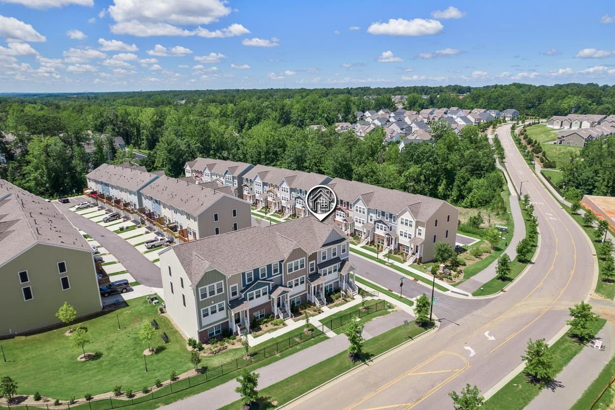 1002 Royal Mill Avenue Wake Forest, NC 27587 - Photo 35 of 51 an aerial view of a house with a garden and lake view