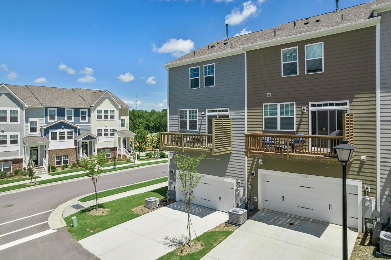 1002 Royal Mill Avenue Wake Forest, NC 27587 - Photo 38 of 51 a front view of a house with a garden