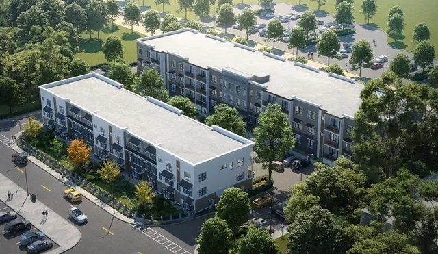 an aerial view of a house with a yard and potted plants
