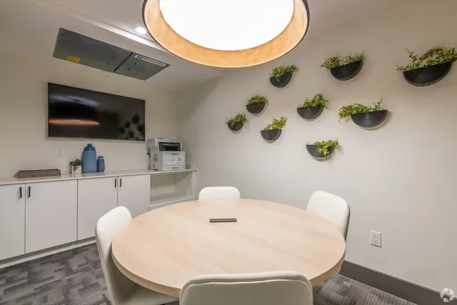 a bathroom with a sink a mirror and a toilet