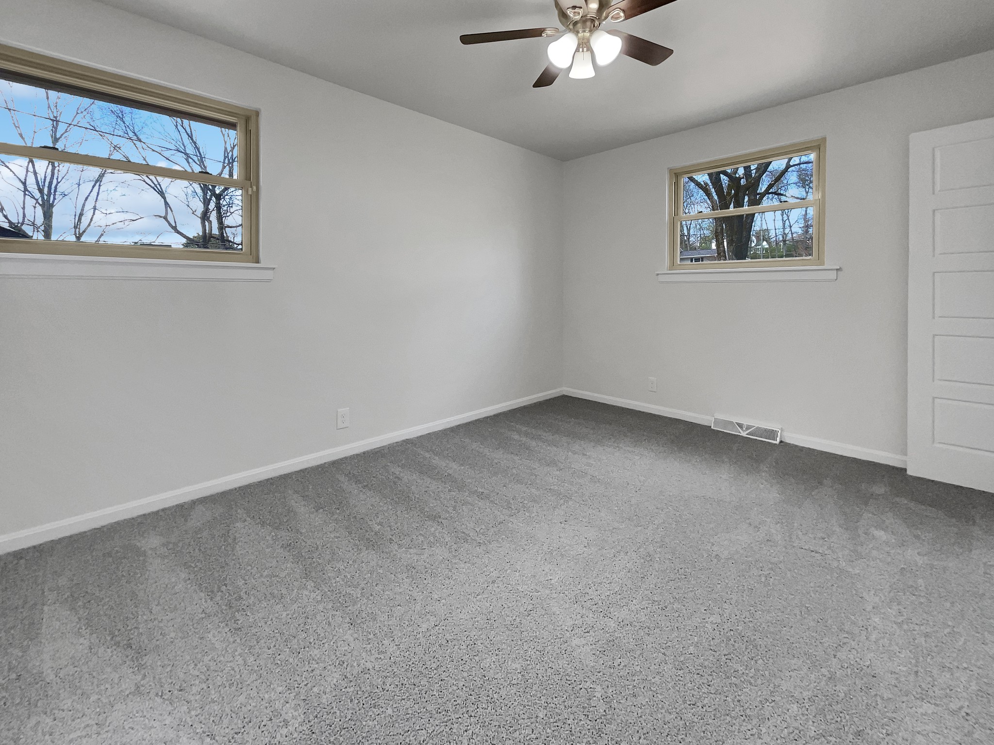 158 Spring Valley Road Nashville, TN 37214 - Photo 11 of 29 an empty room with windows and fan