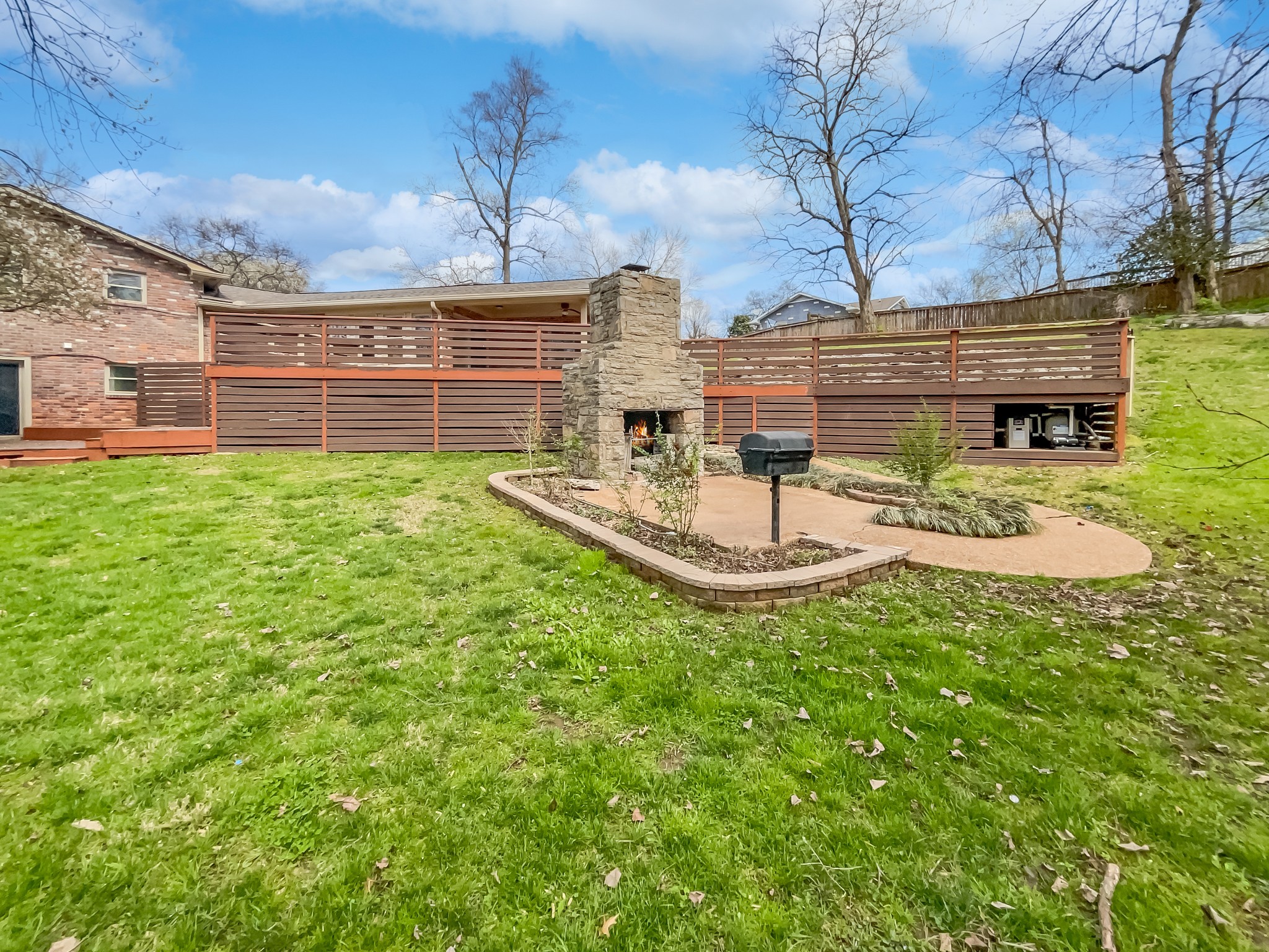 158 Spring Valley Road Nashville, TN 37214 - Photo 12 of 29 a view of a backyard with table and chairs and potted plants