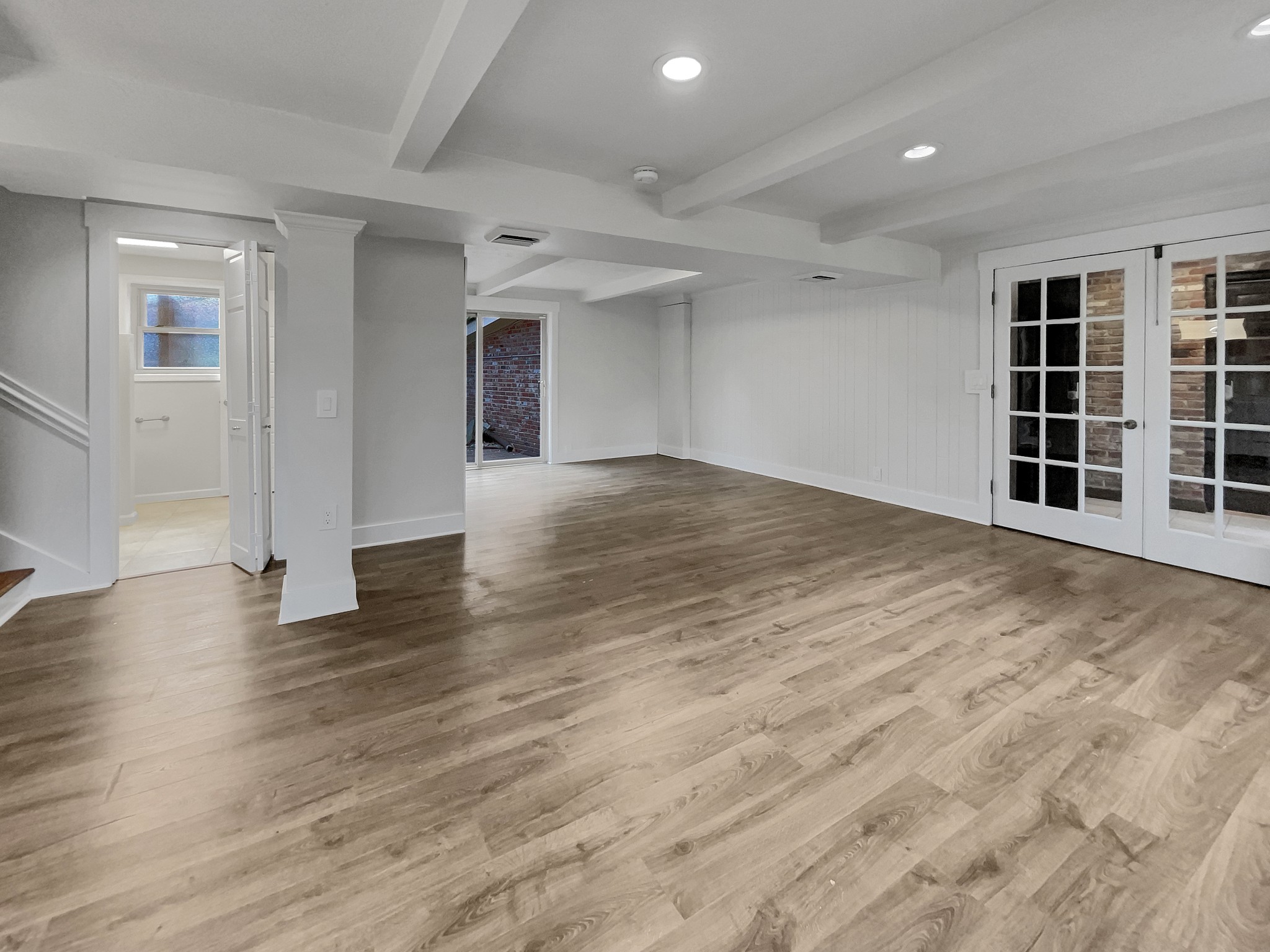 158 Spring Valley Road Nashville, TN 37214 - Photo 13 of 29 an empty room with wooden floor and windows