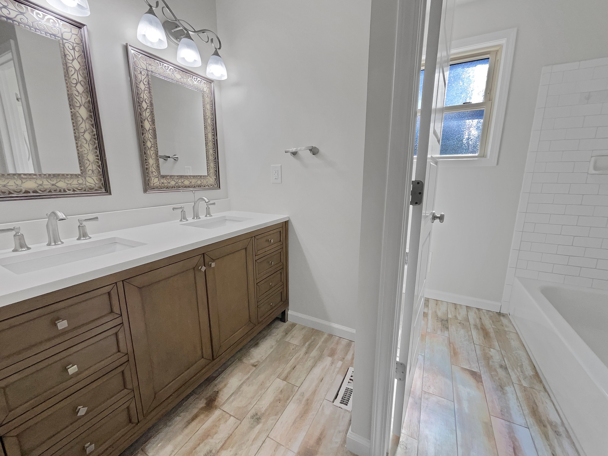 158 Spring Valley Road Nashville, TN 37214 - Photo 20 of 29 a spacious bathroom with a double vanity sink and a mirror