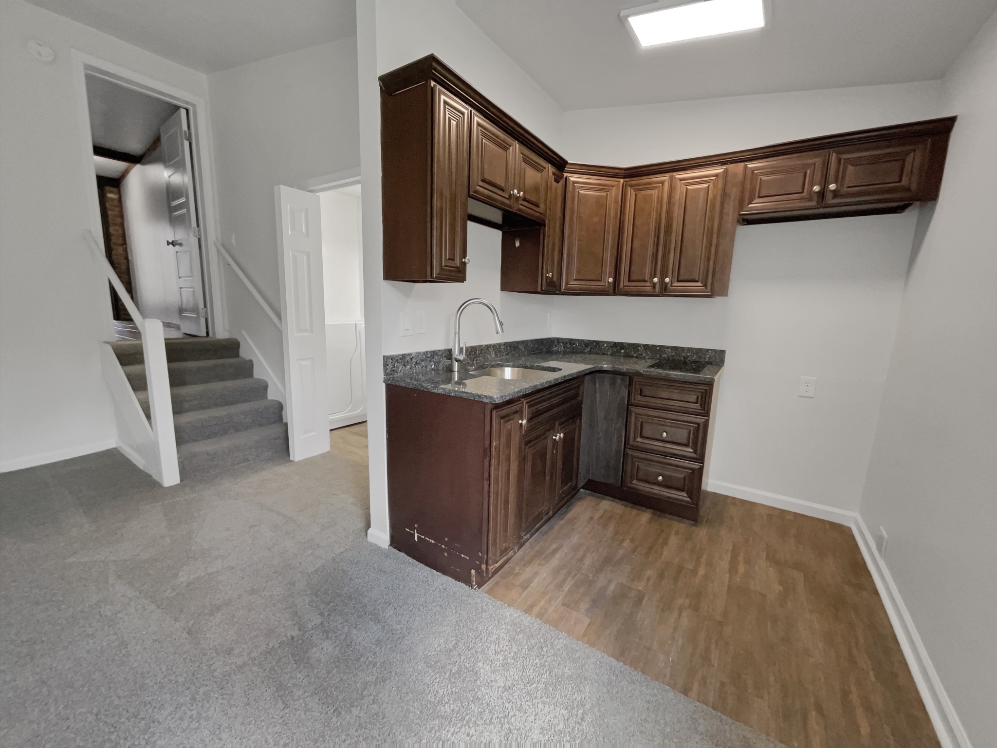 158 Spring Valley Road Nashville, TN 37214 - Photo 22 of 29 a kitchen with stainless steel appliances granite countertop a stove a sink and a refrigerator