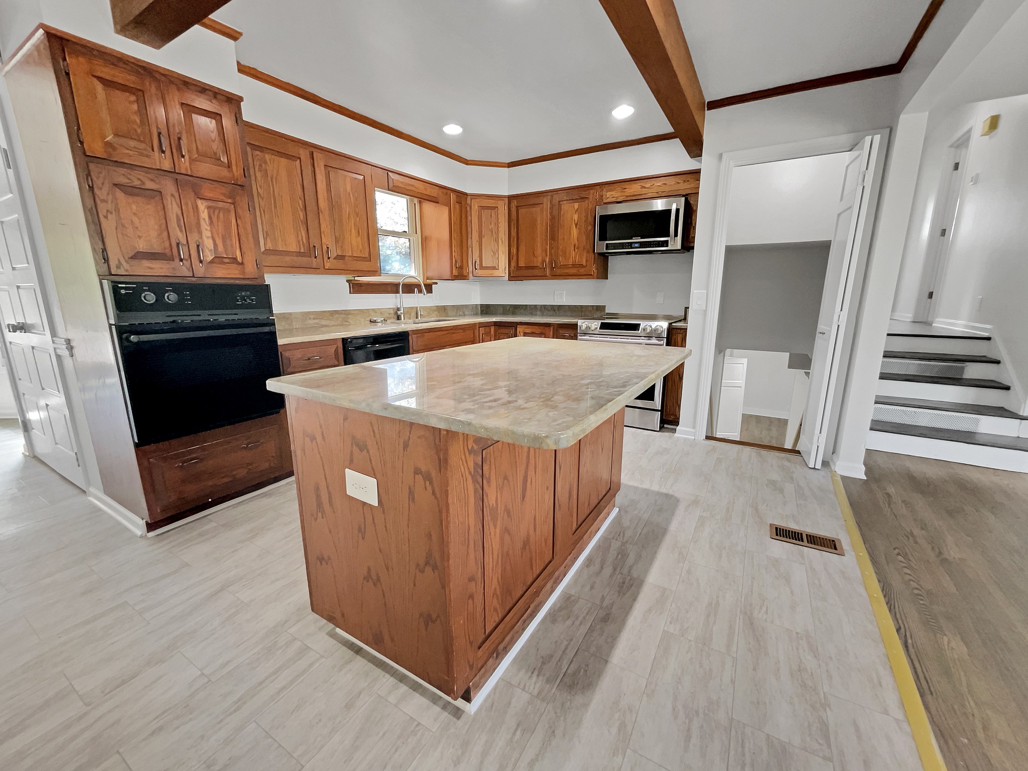 158 Spring Valley Road Nashville, TN 37214 - Photo 23 of 29 a kitchen with stainless steel appliances granite countertop a stove a sink dishwasher and a refrigerator