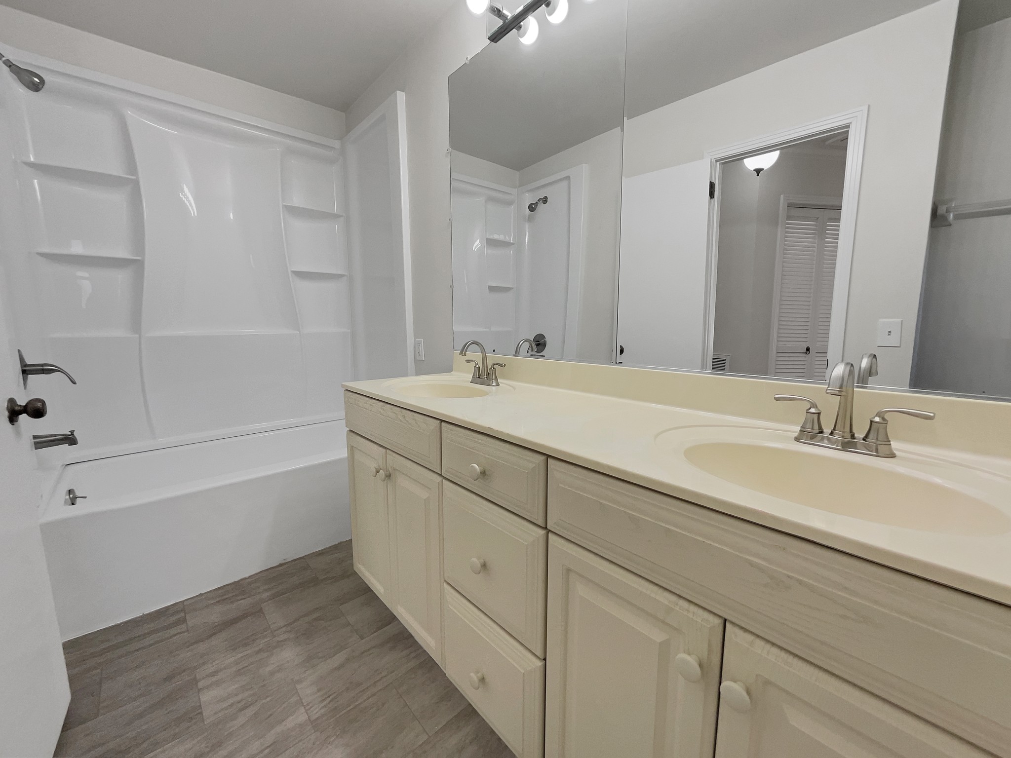 158 Spring Valley Road Nashville, TN 37214 - Photo 25 of 29 a spacious bathroom with a double vanity sink a mirror and a