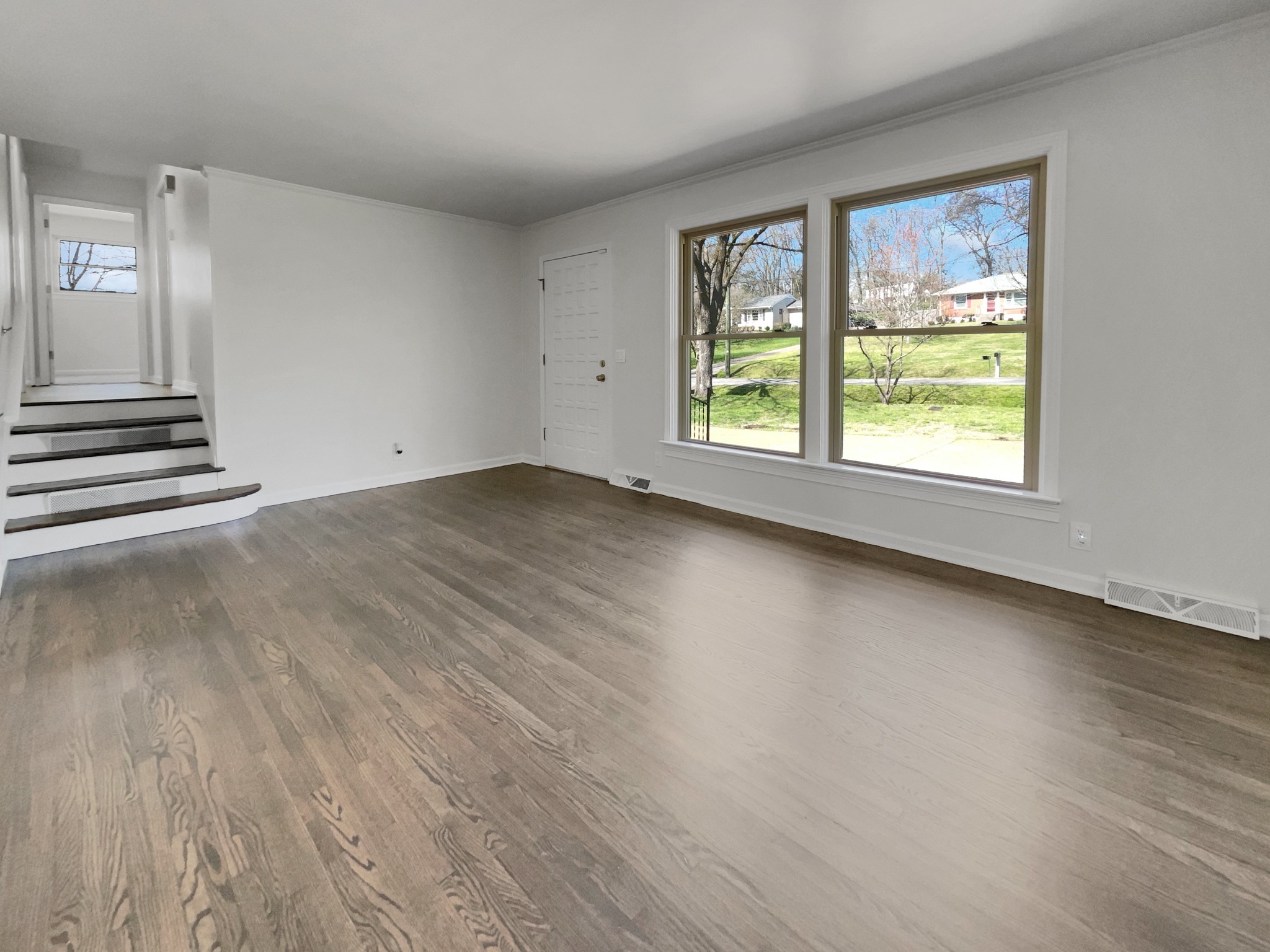 158 Spring Valley Road Nashville, TN 37214 - Photo 26 of 29 an empty room with wooden floor and windows