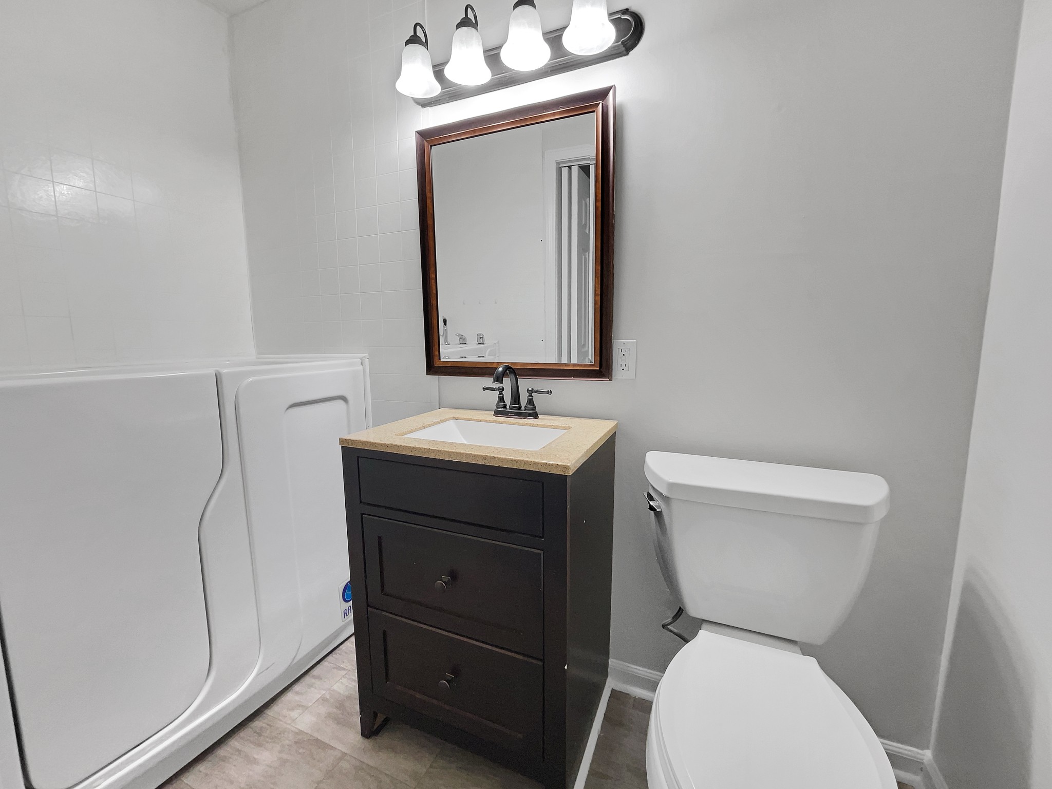 158 Spring Valley Road Nashville, TN 37214 - Photo 27 of 29 a bathroom with a toilet sink and mirror