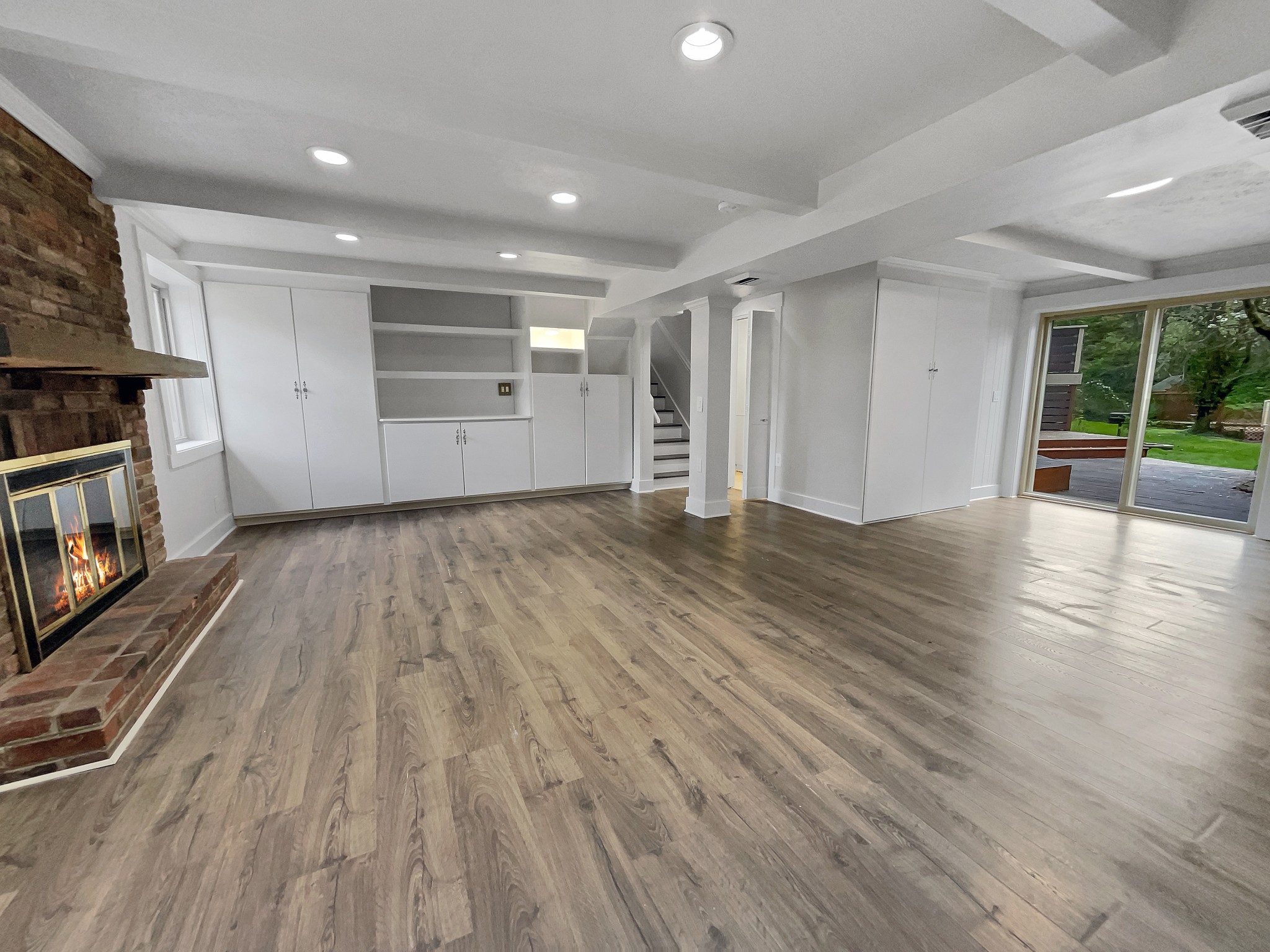 158 Spring Valley Road Nashville, TN 37214 - Photo 4 of 29 an empty room with wooden floor and fireplace