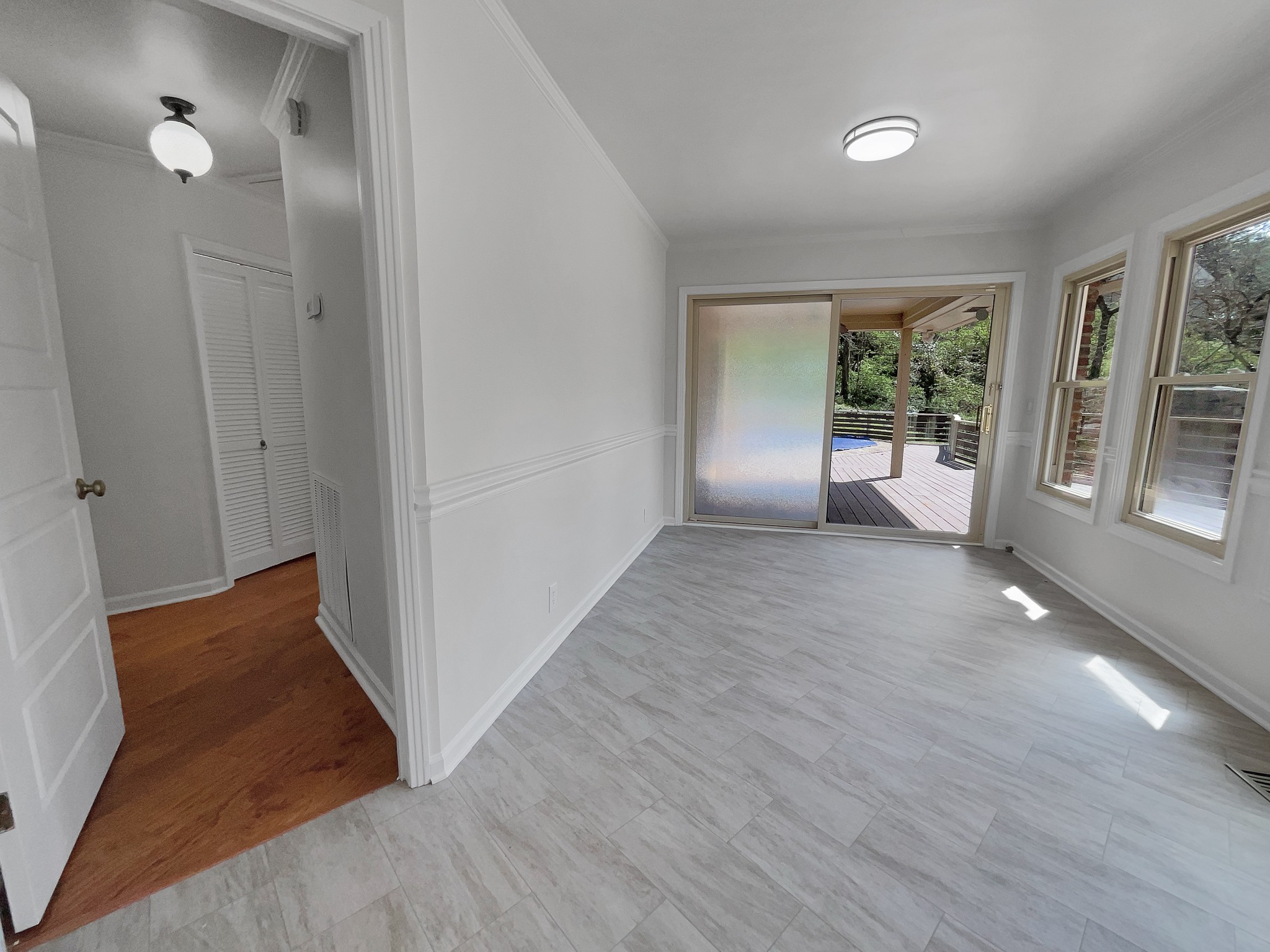 158 Spring Valley Road Nashville, TN 37214 - Photo 9 of 29 a view of an empty room with a window and wooden floor