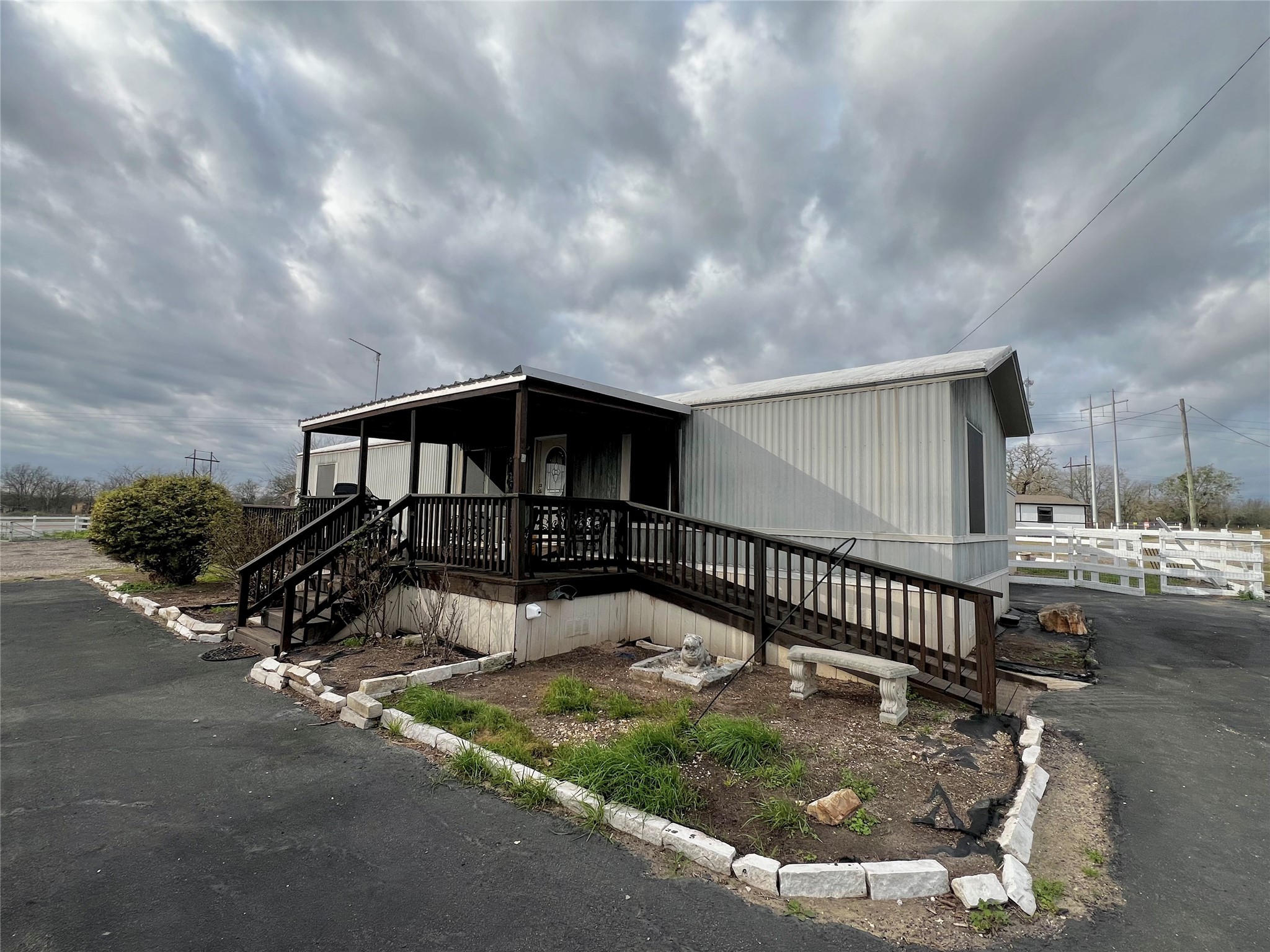 371 Farm To Market 60 Somerville, TX 77879 - Photo 2 of 22 a view of a house with wooden fence