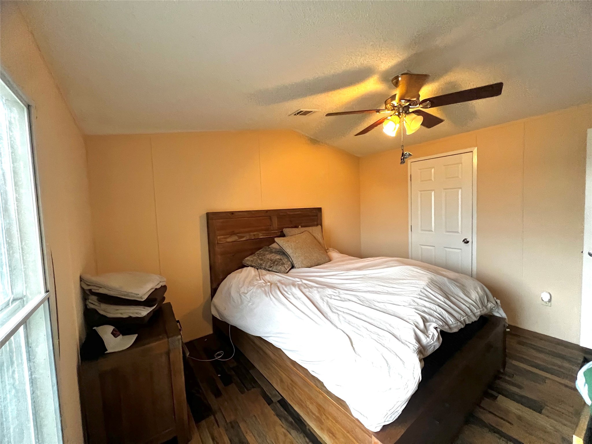 371 Farm To Market 60 Somerville, TX 77879 - Photo 7 of 22 a bedroom with a bed and a ceiling fan
