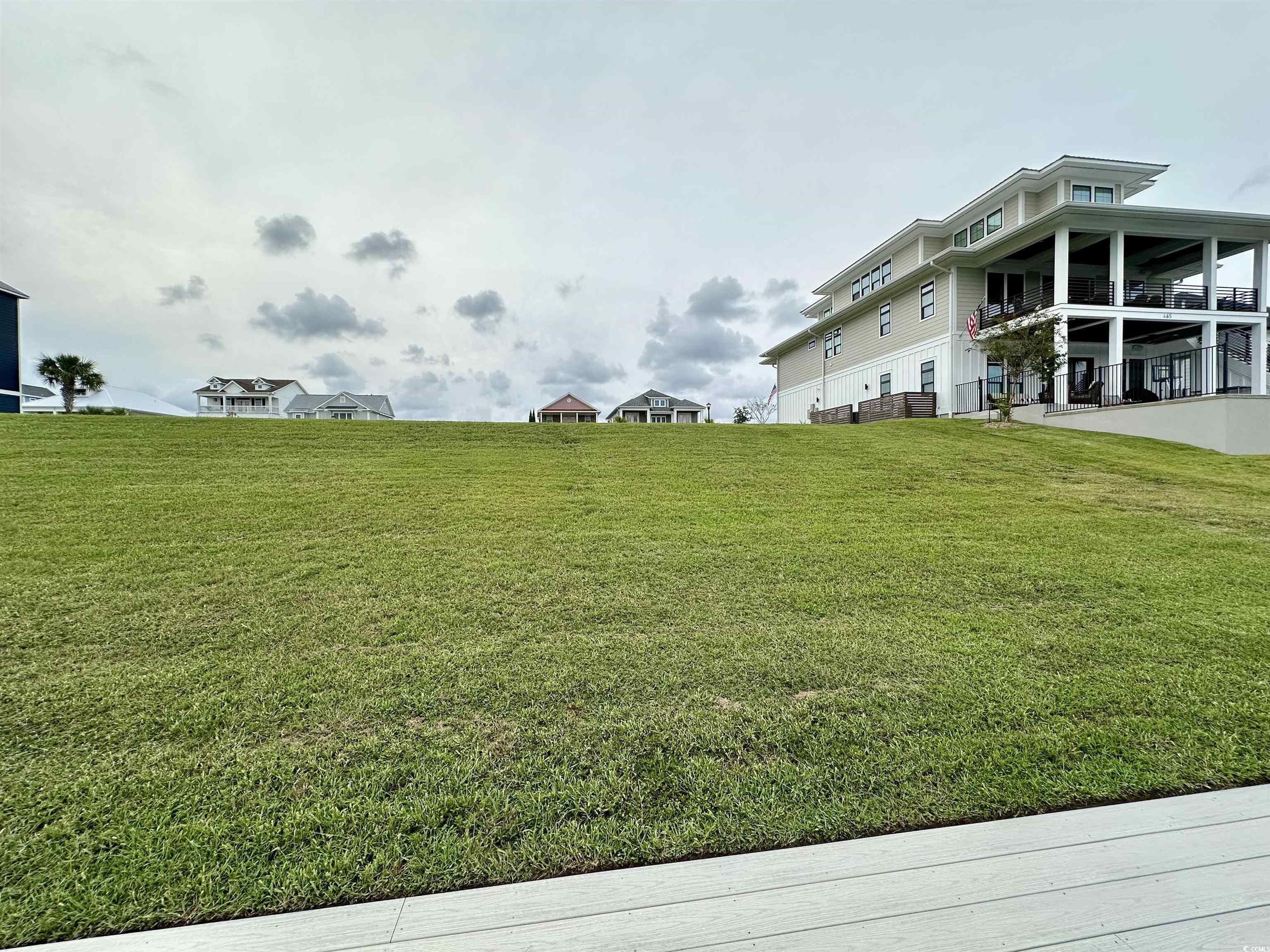 469 Harbour View Drive Myrtle Beach, SC 29579 - Photo 4 of 17 View of yard featuring a balcony