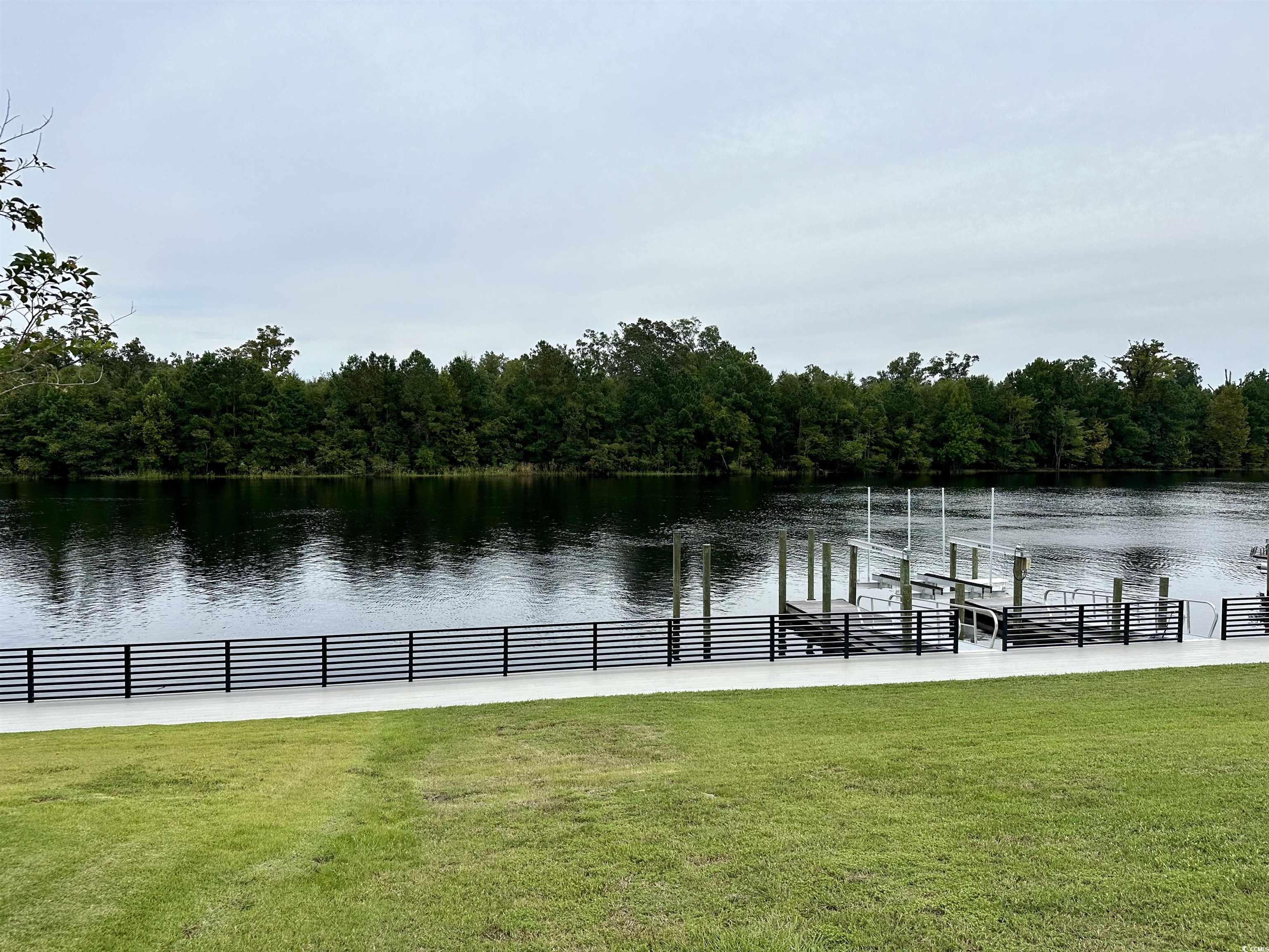 469 Harbour View Drive Myrtle Beach, SC 29579 - Photo 8 of 17 Exterior space with a lawn and a water view