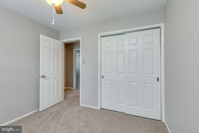 an empty room with closet area