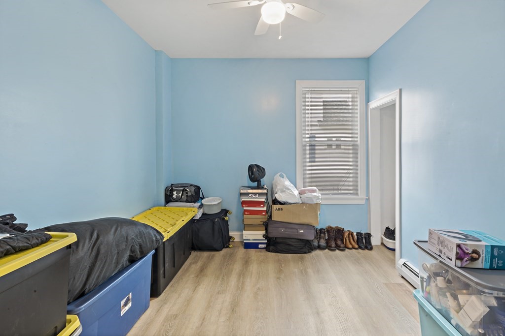 69 Locust Street New Bedford, MA 02740 - Photo 13 of 40 a bedroom with bed and a window