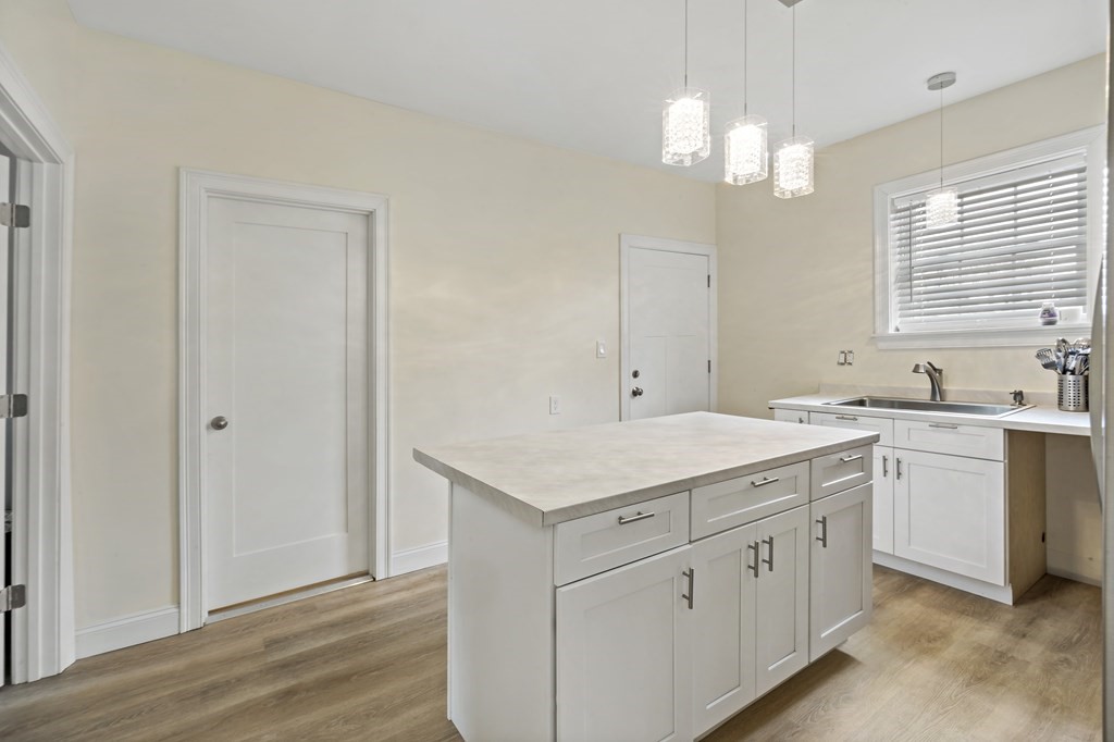 69 Locust Street New Bedford, MA 02740 - Photo 15 of 40 a bathroom with a sink a vanity and a mirror