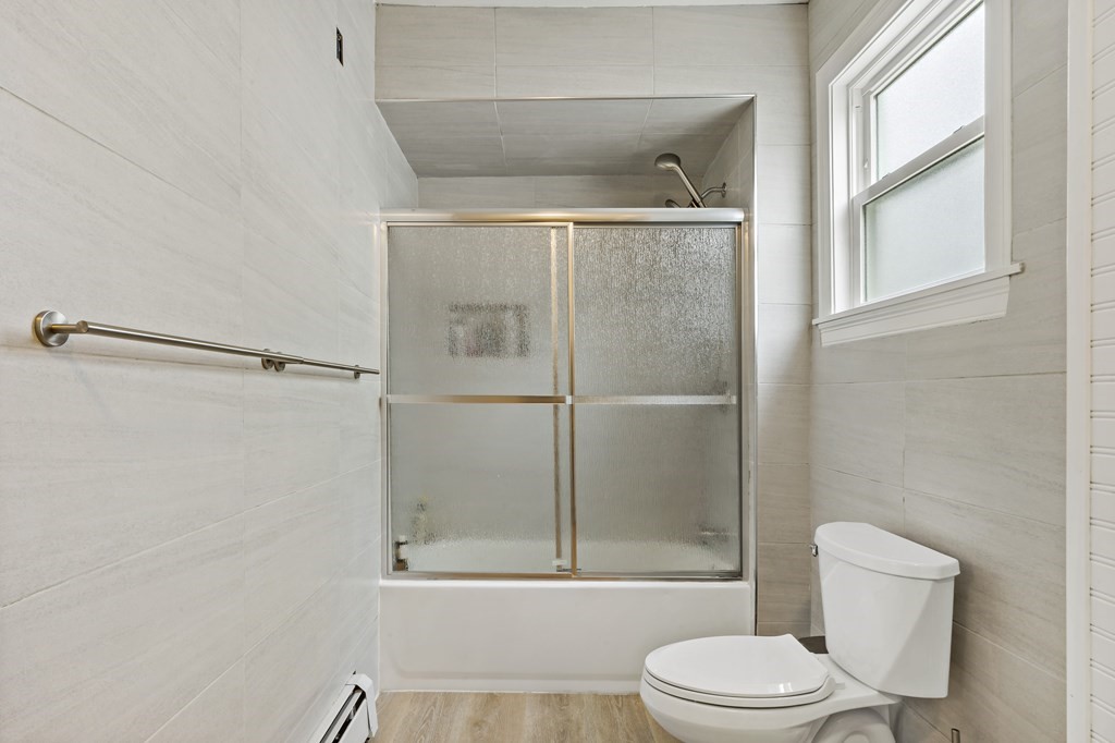 69 Locust Street New Bedford, MA 02740 - Photo 19 of 40 a bathroom with a toilet and a shower