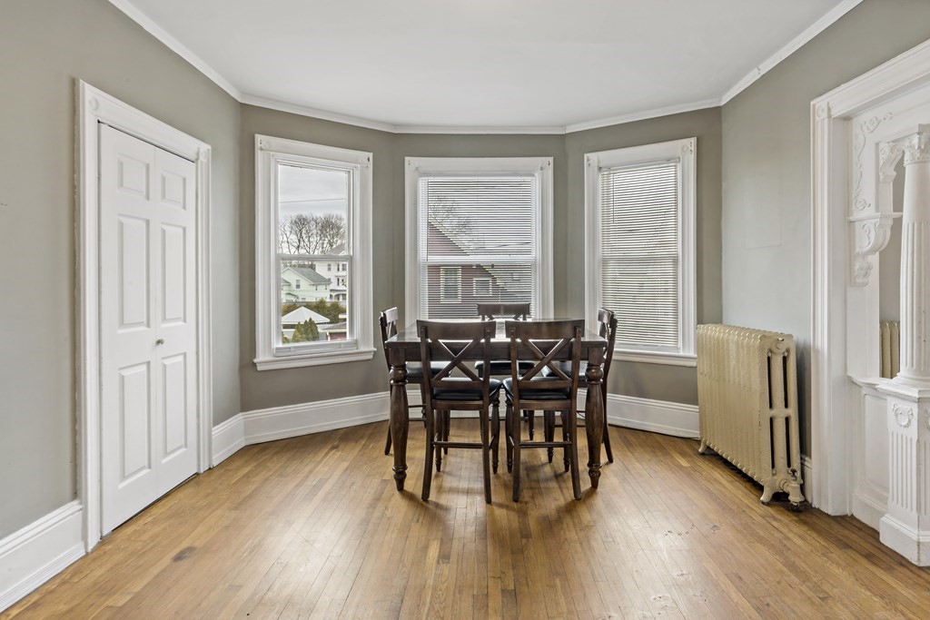 69 Locust Street New Bedford, MA 02740 - Photo 22 of 40 a dining room with furniture window wooden floor