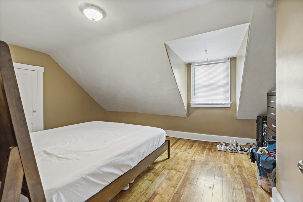 69 Locust Street New Bedford, MA 02740 - Photo 35 of 40 a bed room with a bed