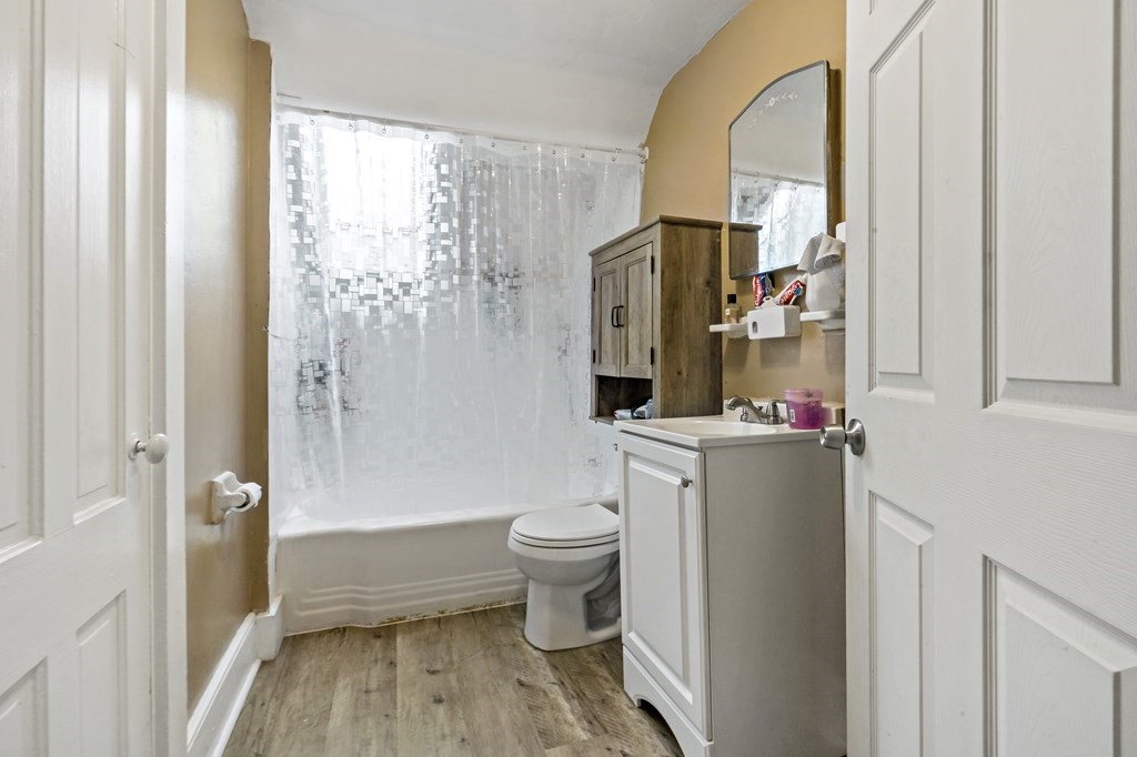 69 Locust Street New Bedford, MA 02740 - Photo 37 of 40 a bathroom with a toilet a sink and a shower