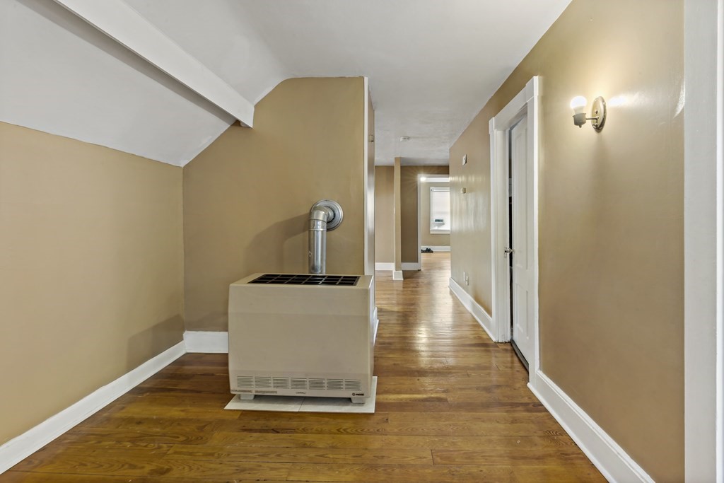 69 Locust Street New Bedford, MA 02740 - Photo 38 of 40 a view of a hallway with wooden floor