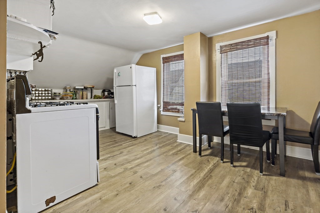69 Locust Street New Bedford, MA 02740 - Photo 39 of 40 a view of a workspace with furniture and wooden floor