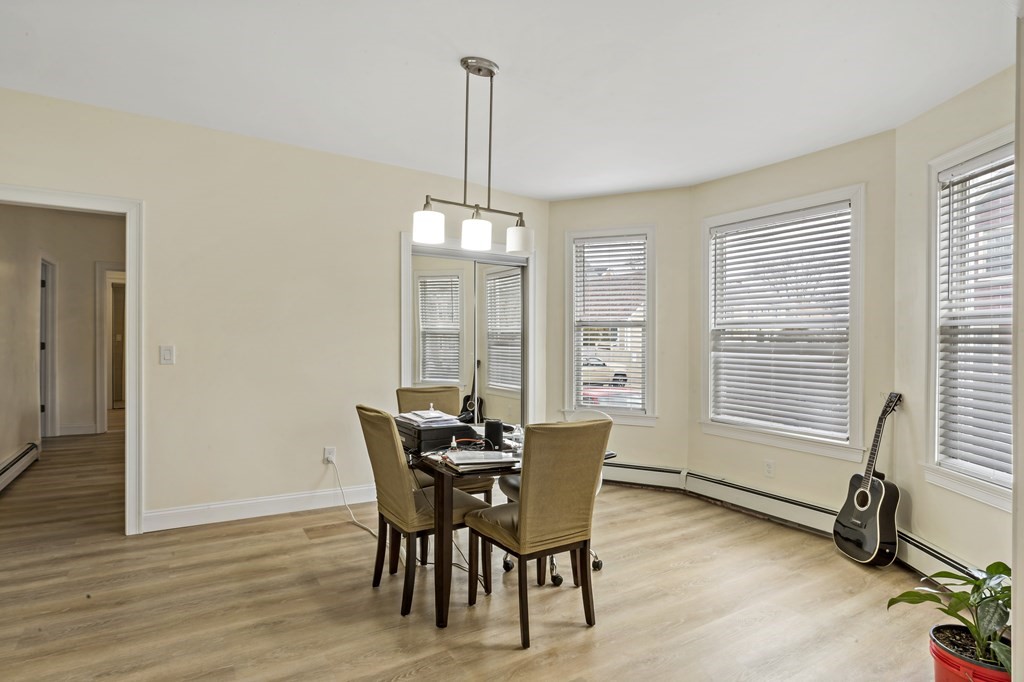 69 Locust Street New Bedford, MA 02740 - Photo 7 of 40 a view of a dining room with furniture window and outside view
