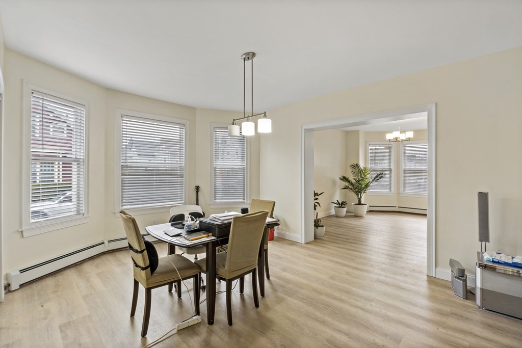 69 Locust Street New Bedford, MA 02740 - Photo 8 of 40 a view of a dining room with furniture window and wooden floor