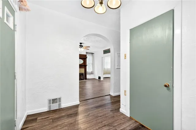 a bathroom with a toilet a sink and a mirror