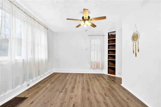 a view of a livingroom with wooden floor