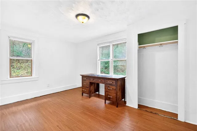 a view of livingroom with hardwood floor and hallway