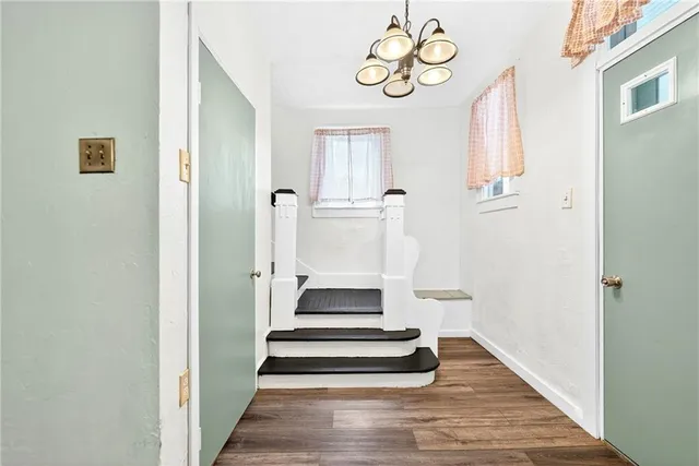 a view of entryway with wooden floor