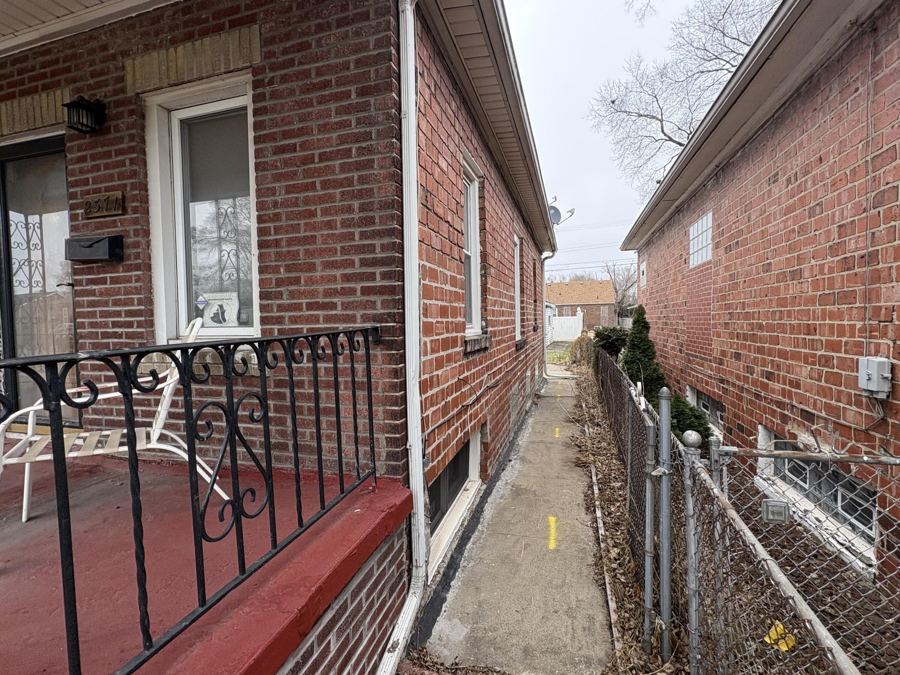 2371 Monroe Street Gary, IN 46407 - Photo 17 of 17 a view of a balcony with wooden floor and stairs