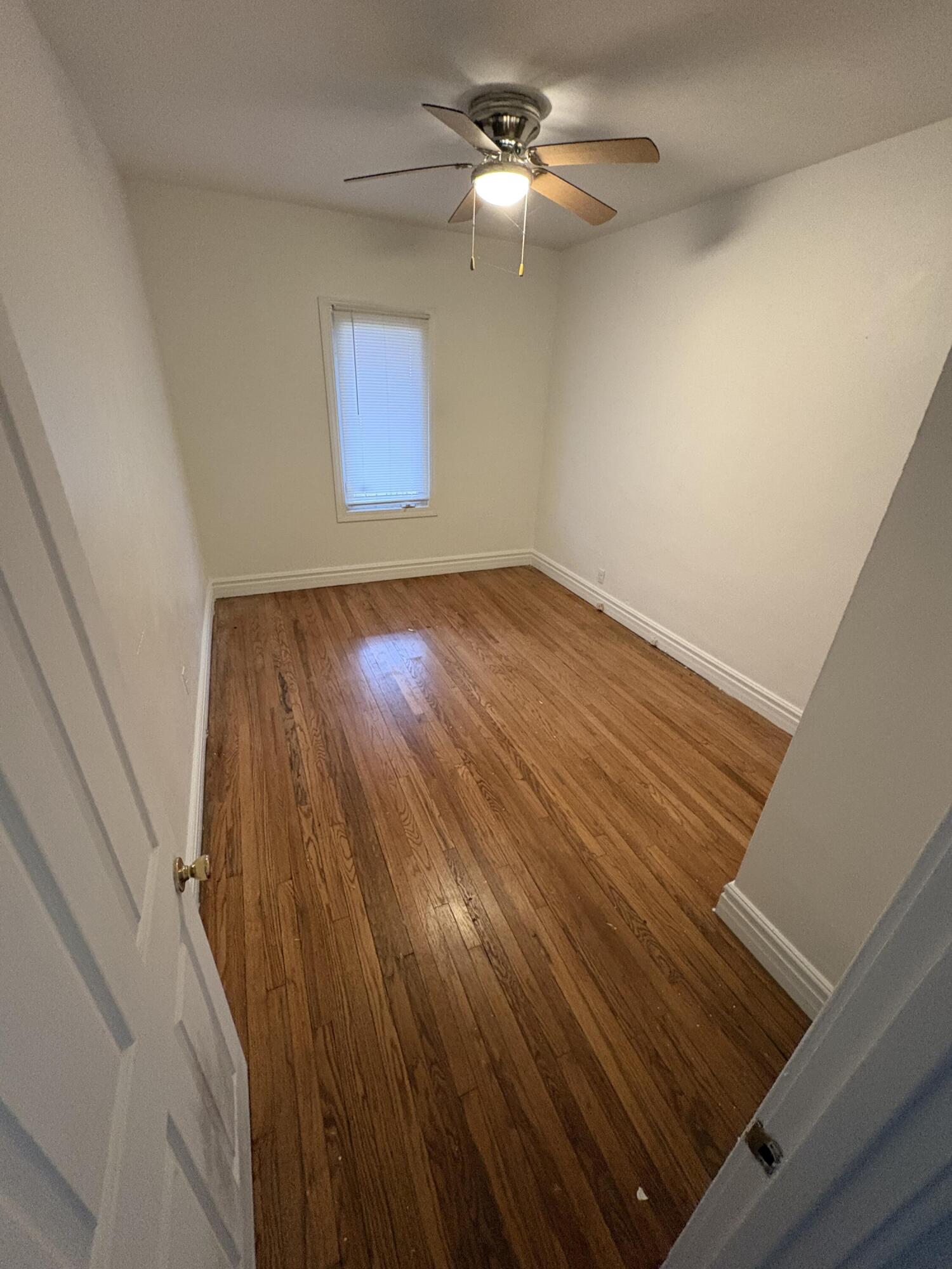 2371 Monroe Street Gary, IN 46407 - Photo 3 of 17 a view of empty room with wooden floor