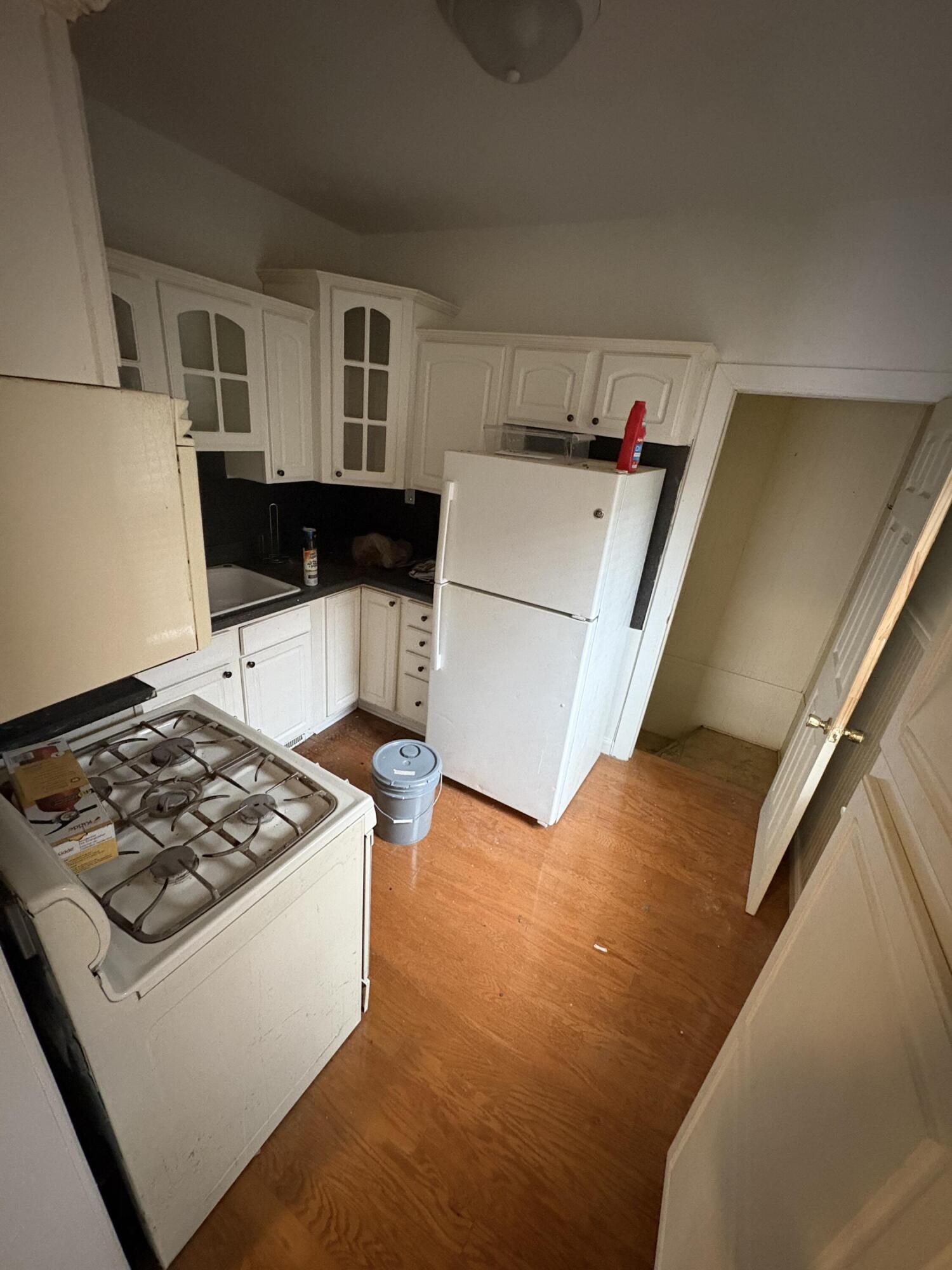 2371 Monroe Street Gary, IN 46407 - Photo 6 of 17 a kitchen with a stove and a refrigerator