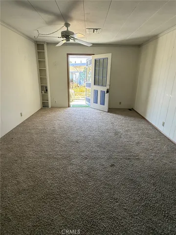 an empty room with a empty space and windows