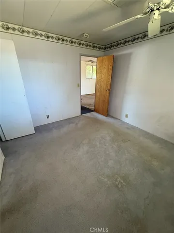 a view of a storage & utility room with windows