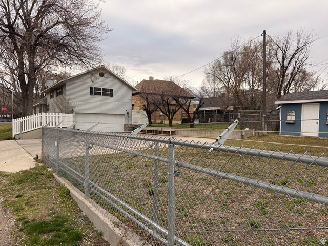 110 South 200 East Springville, UT 84663 - Photo 21 of 23 View of front of home with an attached garage and concrete driveway