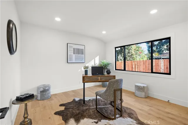 a spacious bathroom with a bathtub sink and mirror