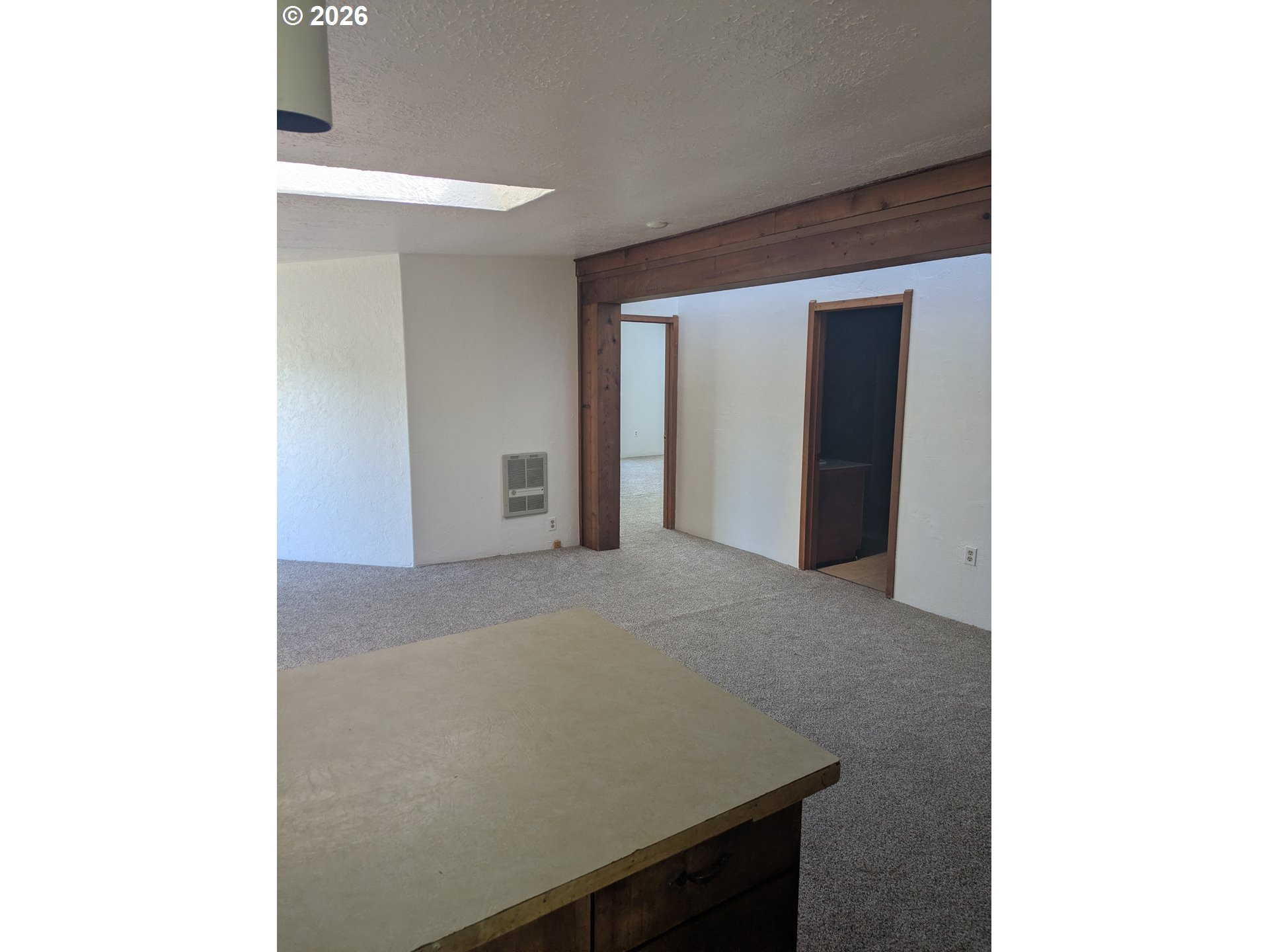 1116 7th Street Florence, OR 97439 - Photo 13 of 15 a view of an empty room with wooden floor
