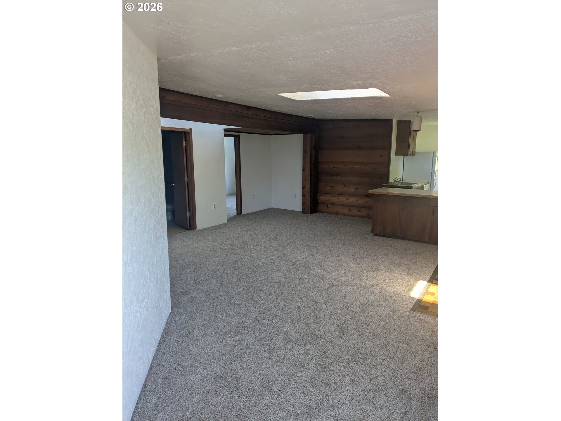 1116 7th Street Florence, OR 97439 - Photo 3 of 15 a view of a livingroom with an empty space