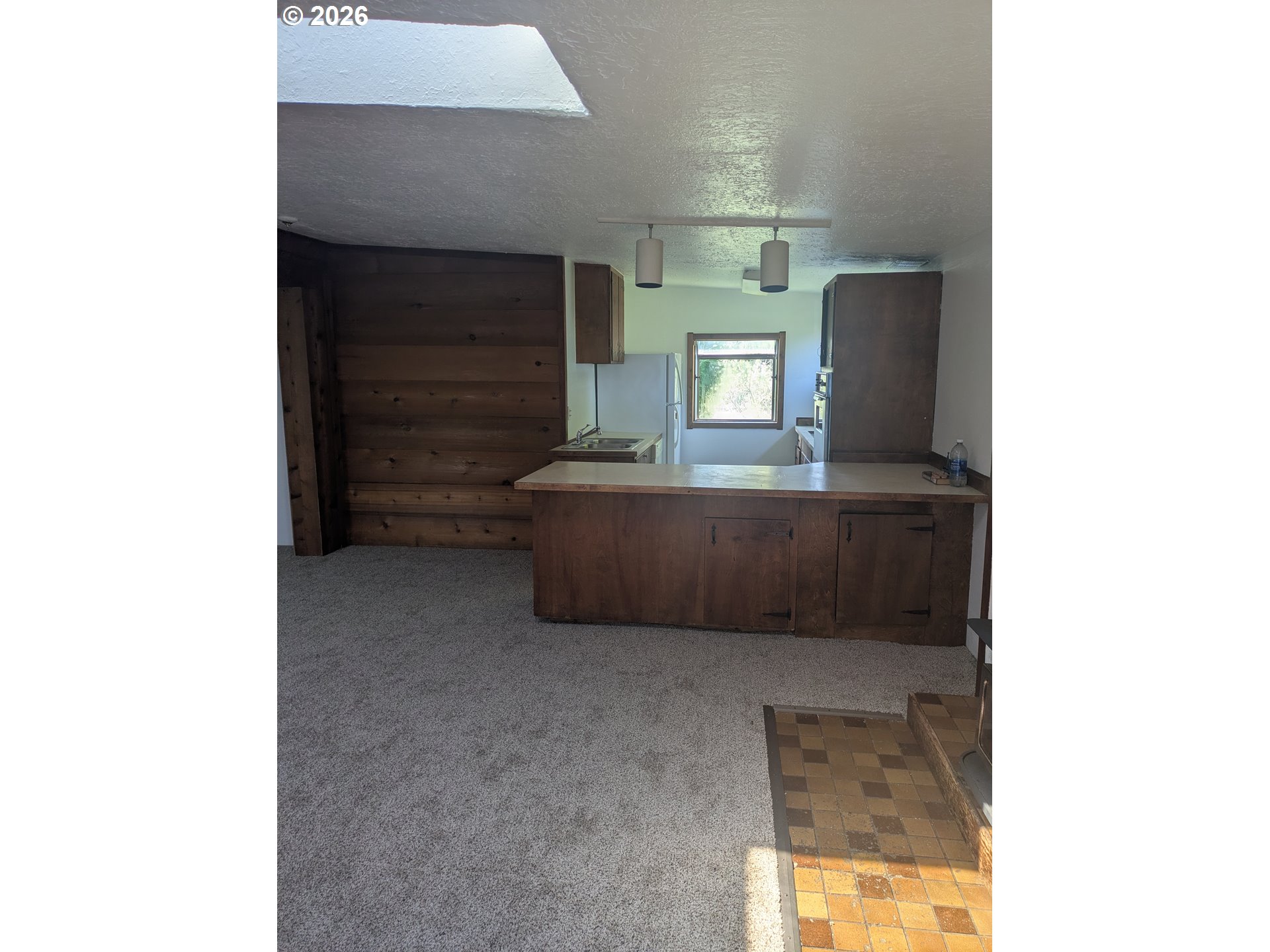 1116 7th Street Florence, OR 97439 - Photo 4 of 15 a living room with furniture and a window
