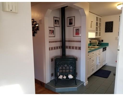11 Crestview Road Waltham, MA 02451 - Photo 10 of 14 a kitchen with stainless steel appliances a stove and a microwave