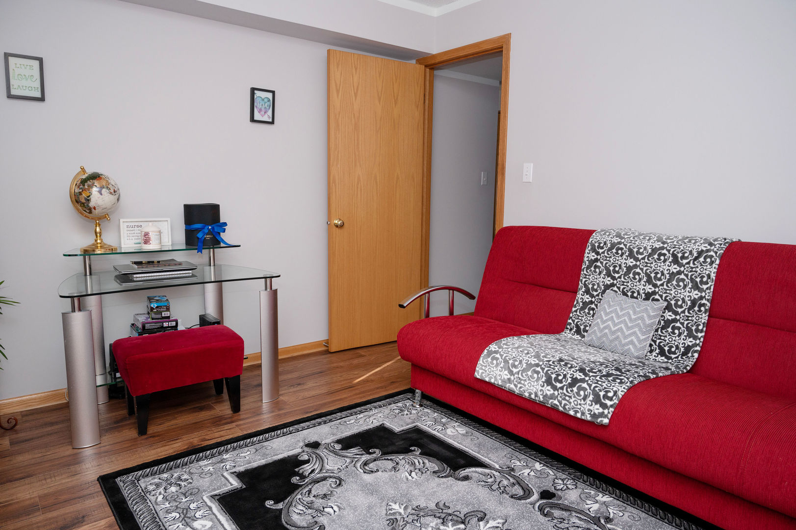 18124 Rita Road, Unit 2C Tinley Park, IL 60477 - Photo 17 of 23 a living room with furniture rug and wooden floor