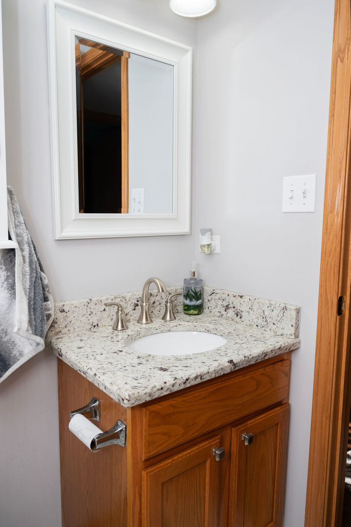 18124 Rita Road, Unit 2C Tinley Park, IL 60477 - Photo 20 of 23 a bathroom with a granite countertop sink and a mirror