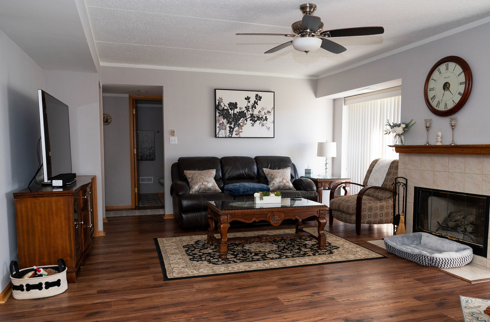 18124 Rita Road, Unit 2C Tinley Park, IL 60477 - Photo 5 of 23 a living room with furniture a fireplace and a flat screen tv